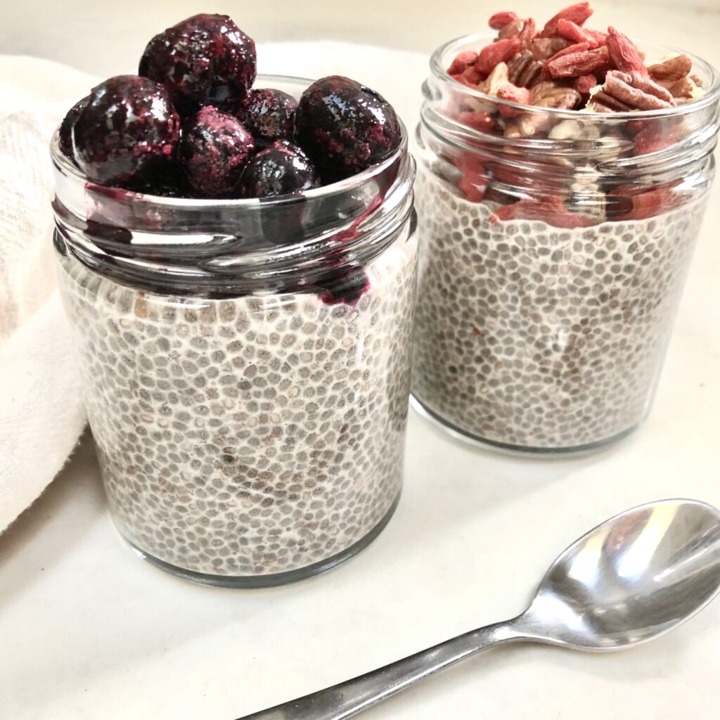 chia pudding in jars topped with berries