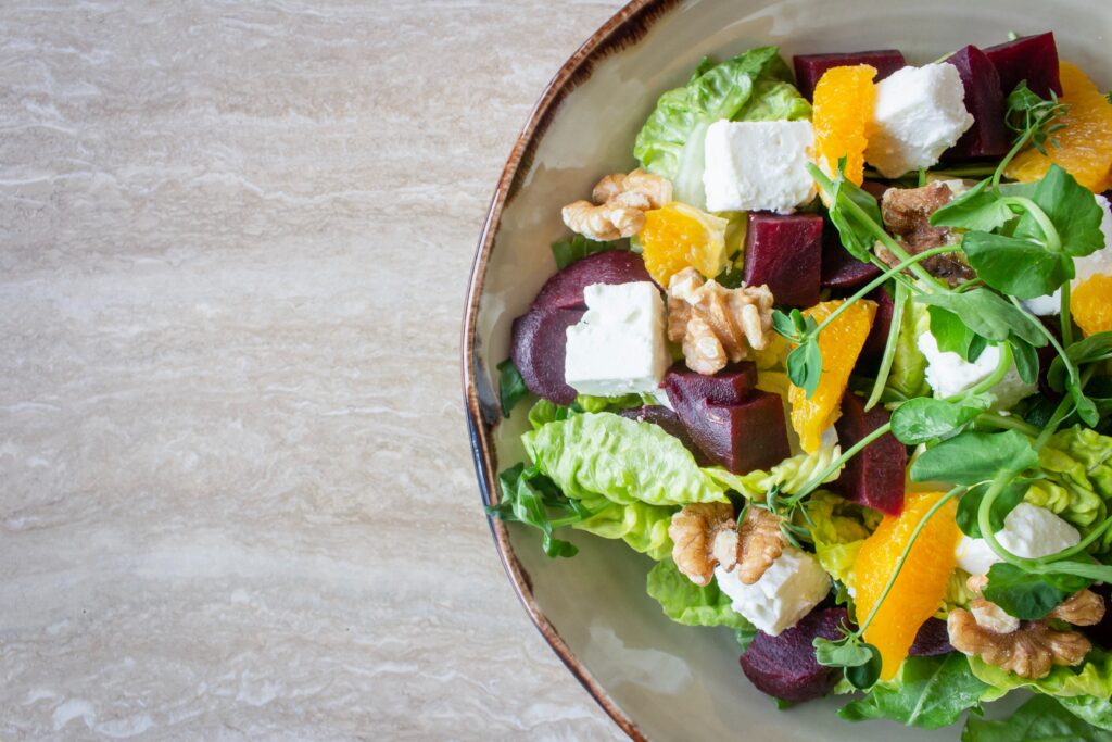salad with beets, goat cheese, walnuts, oranges, greens